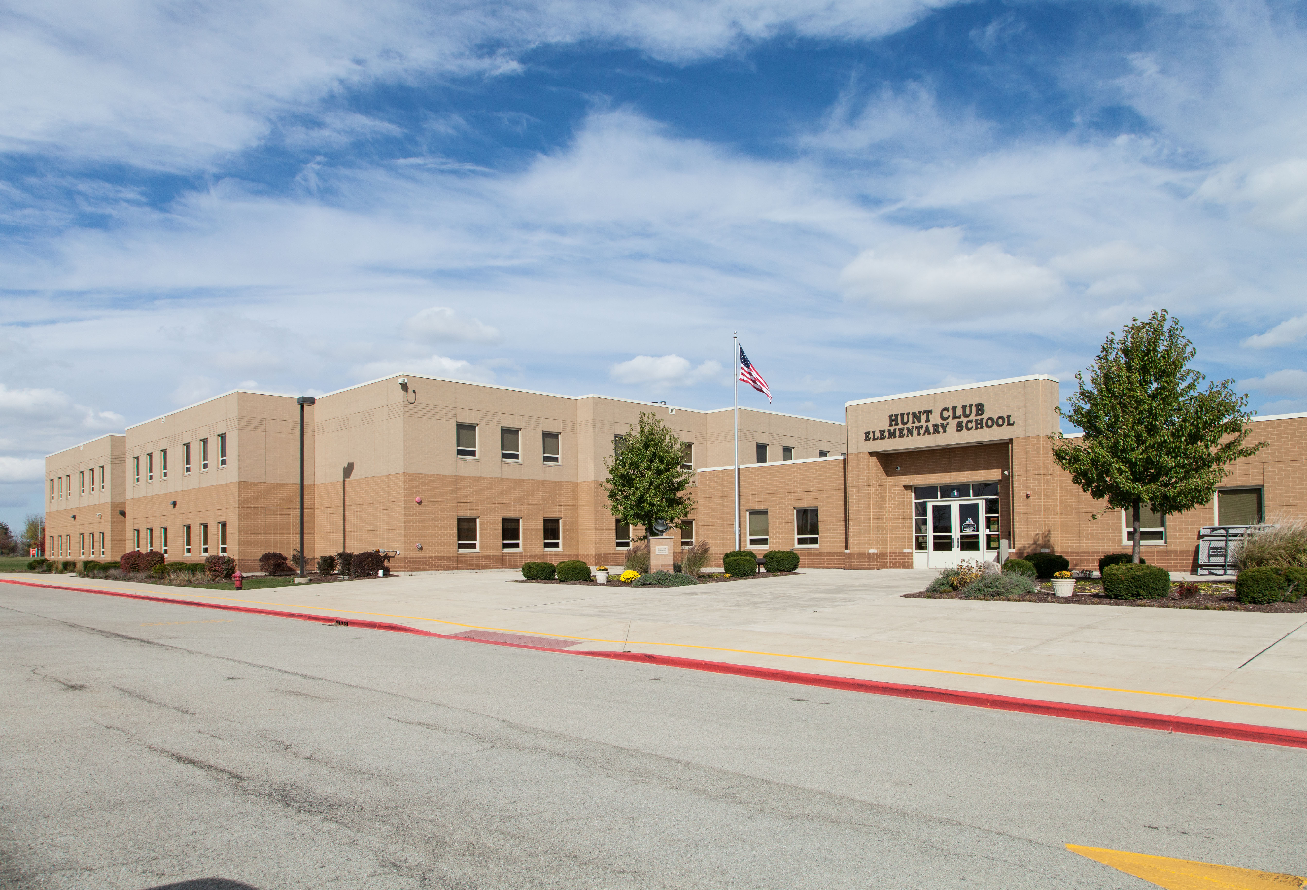 Hunt club building front with blue sky in the background